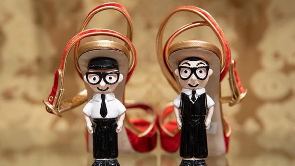 Shoes with the heels made out of figurines representing Italian fashion designers Domenico Dolce (left) and Stefano Gabbana are displayed at a store in Beijing (AFP)
