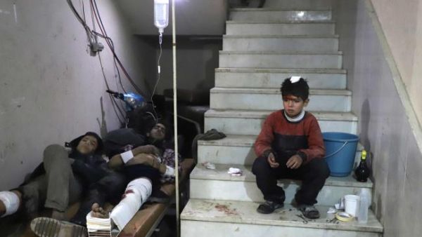 Wounded Syrians wait to receive treatment in the besieged Eastern Ghouta (AFP/File Photo)
