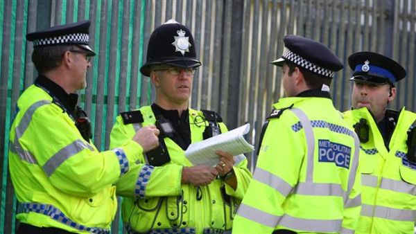 British police officers deliberating (AFP/File Photo)	