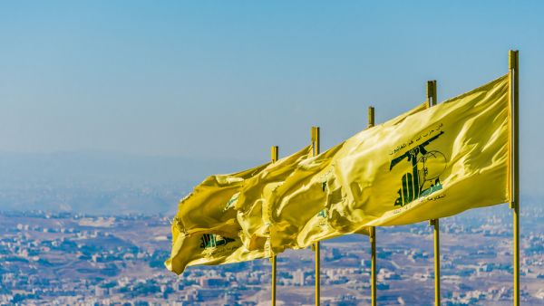 Hezbollah flags over southern Lebanese land (Shutterstock)