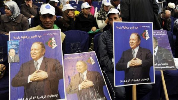 Supporters of Algerian President Abdelazziz Bouteflika gather during a political meeting ahead of the country's presidential election in 2014. (AFP/Farouk Batiche)
