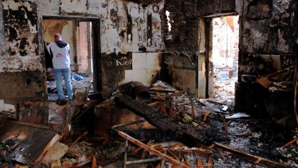 Medecins Sans Frontieres staff walk in the damaged MSF hospital in northern Kunduz, on November 10, 2015. (AFP/Najim Rahim) Medecins Sans Frontieres staff walk in the damaged MSF hospital in northern Kunduz, on November 10, 2015. (AFP/Najim Rahim)