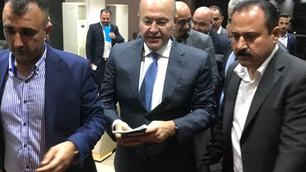 Iraq's newly elected president, Kurdish politician Barham Salih (C). (AFP/File)