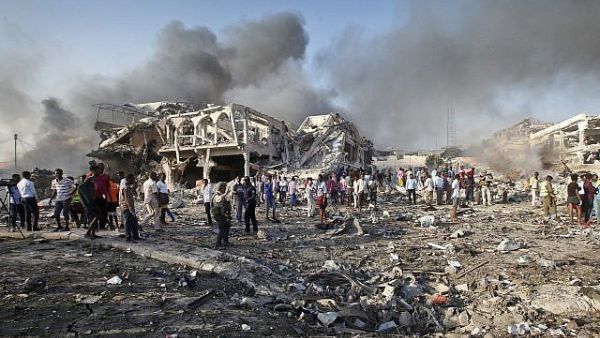 Somalis gather and search for survivors at the scene of a blast in the capital Mogadishu. (AFP)