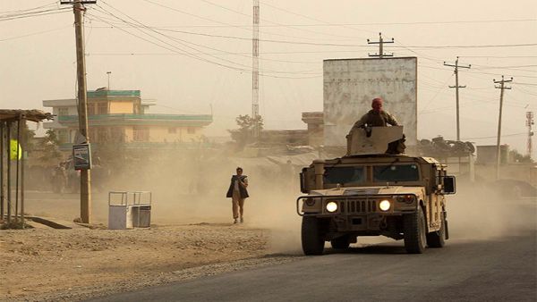 Afghan security forces travel in a Humvee vehicle, as battles were ongoing between Taliban militants and Afghan security forces, in Kunduz, capital of northeastern Kunduz province. (AFP)  
