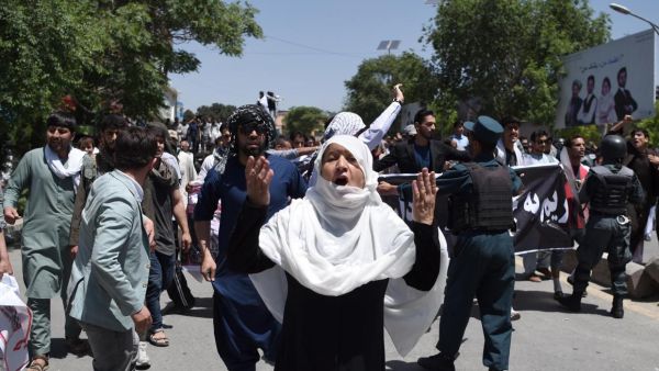 Afghan protesters shout anti-government slogans during a protest against the government following a truck bomb attack near Zanbaq Square on 2 June. (AFP/ Wakil Kohsar) 