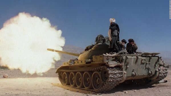 Taliban soldiers in Russian-made tanks fire on the forces of former Afghan defense minister. (AFP)
