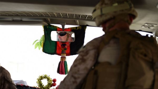 A US soldier drives a bus ahead of handover ceremony at Leatherneck Camp in Lashkar Gah in the Afghan province of Helmand on April 29, 2017. (AFP/Wakil Kohsar)