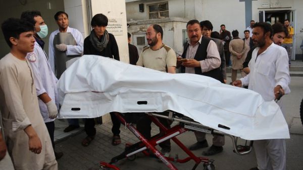 Afghan volunteers carry a dead body on a stretcher to a hospital following a suicide attack in Kabul on August 15, 2018. At least 37 people, the majority of them students, were killed when a suicide blast ripped through a school in a Shiite area of Kabul on August 15. (AFP/ File)

