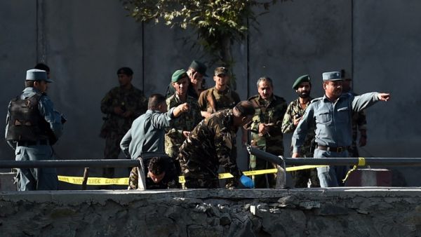 Afghan security personnel investigate the site of a twin suicide bombing near the Ministry of Defense in Kabul on September 5, 2016. The death toll from a Taliban double suicide bombing in the Afghan capital Kabul jumped to 24 with 91 wounded, the health ministry said. (AFP/Wakil Kohsar)