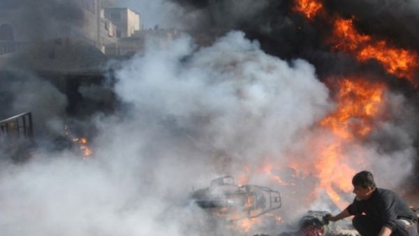 A Palestinian man rushes to the scene moments after an Israeli airstrike on Rafah, in the southern Gaza Strip. (AFP/ File)