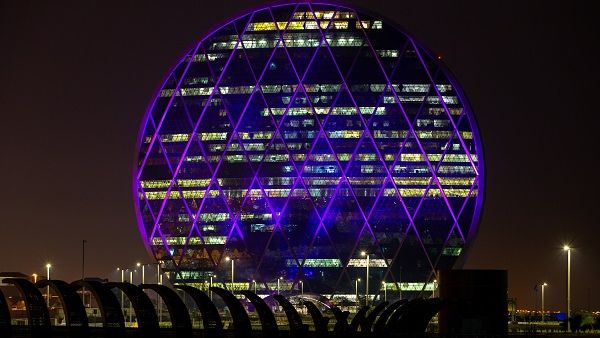 Aldar HQ building turns purple for NYUAD's fifth Commencement. Aldar HQ building turns purple for NYUAD's fifth Commencement.