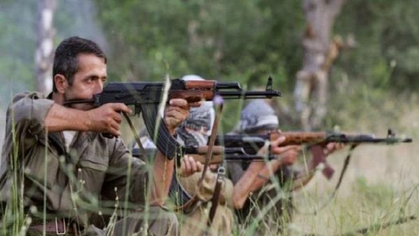 PKK fighters take position with their rife during a traning session. (AFP/File) 