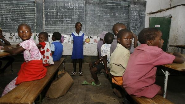 Zimbabwean children sit in a classroom at a school in Zimbabwa. (AFP/Desmond Kwande)