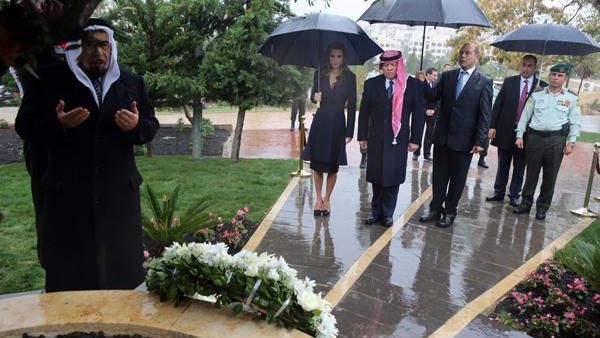 Their Majesties King Abdullah and Queen Rania join family members of the Amman bombing victims at a ceremony marking the tenth anniversary of the attacks last year. (AFP/File) 