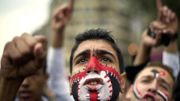 An Egyptian anti-regime protester shouts slogans during a demonstration calling for the interim military rulers to step down in Tahrir Square in Cairo on 27 November 2011. (AFP/Odd Andersen)