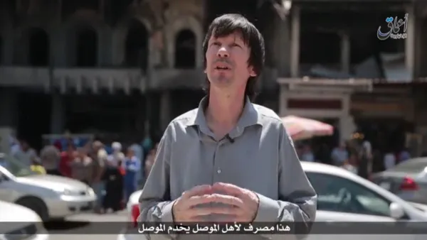 John Cantlie speaks in the latest Isis propaganda video in front of the bombed-out Mosul University. (Twitter) 