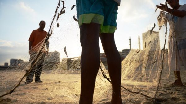 Palestinian fishermen on the beach in Gaza City. (AFP/Roberto Schmidt)