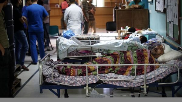Palestinian patients lie on hospital beds in the Al-Wafa rehabilitation hospital near Gaza City.  (AFP/Thomas Coex)