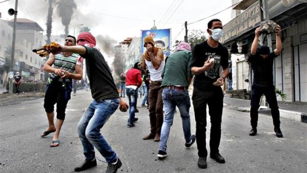 Palestinian stone throwers clash with Israeli security forces following Friday prayers on Friday, in West Bank town of Hebron. (AFP/File) 