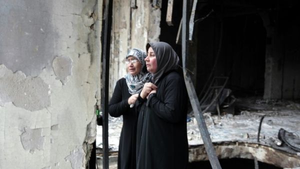 Iraqi women surveil the aftermath of a massive bombing in Baghdad's Karrada neighbourhood on July 4, 2016. (AFP/File)

