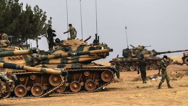 Turkish Army soldiers walking by tanks near Turkish Syrian border of Karkamis. (AFP/File) 