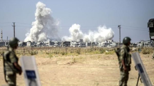 Smoke rises in the Syrian city of Kobani from heavy fighting seen from the Turkish border. (AFP/File)