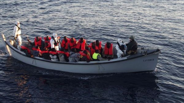Italian navy personnel and rescued migrants ride in a boat after a resuce operation off the Libyan coast, in the Mediterranean Sea. (AFP/file)   Italian navy personnel and rescued migrants ride in a boat after a resuce operation off the Libyan coast, in the Mediterranean Sea. (AFP/file)