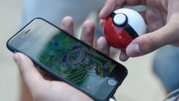 The new mobile app, which is based on a 1990s Nintendo game, has created a global frenzy as players roam the real world looking for cartoon monsters (AFP/Josep Lago)