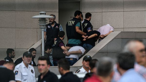 Detained Turkish soldiers who allegedly took part in a military coup arrive with their hands bound behind their backs at the Istanbul Justice Palace on July 20, 2016, following the failed military coup attempt of July 15. (AFP/Ozan Kose) 