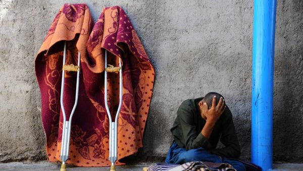 An Afghan patient sits in a yard at the only mental health rehabilitation center in the city of Herat in April 2014.
(AFP/ File Photo)