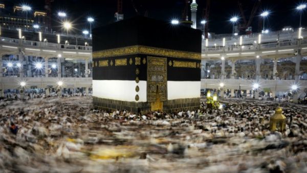 Pilgrims walk counterclockwise around Islam's holiest shrine, the Kaaba, at the Grand Mosque in Mecca, Saudi Arabia (AFP/File Photo)	