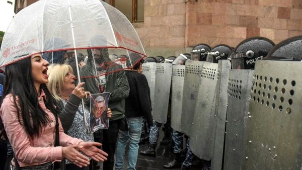It's a tumultuous day for Armenia, given that the annual commemoration of the Armenian Genocide occurs amidst the shock resignation of President Serzh Sargsyan. / AFP / Vano SHLAMOV