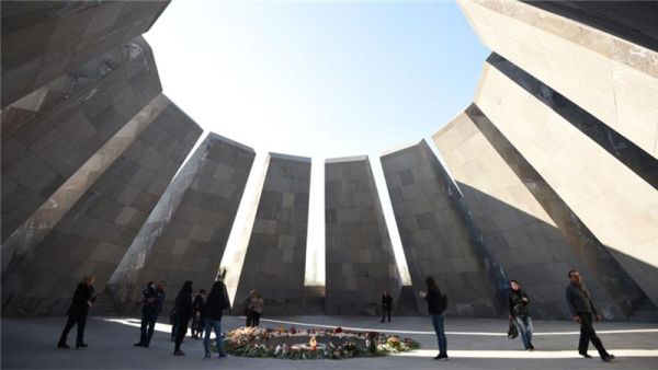 People lay flowers at the Tsitsernakaberd Memorial in Yerevan to commemorate the Armenian Genocide. (AFP/File)
