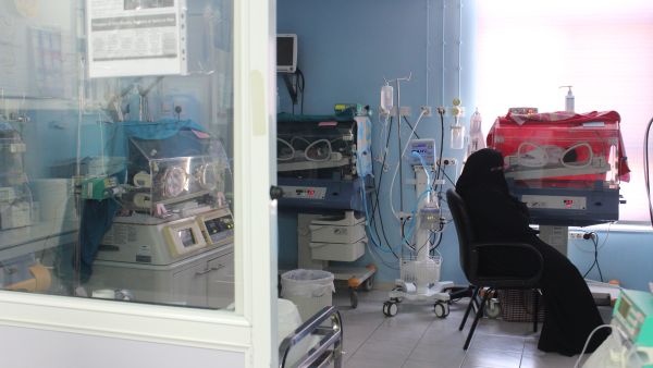 Ayesha (not her real name), a new mother from Syria, waits by one of her twins in Neo-Natal care unit in the MSF Mother And Child Hospital in Irbid, Jordan.