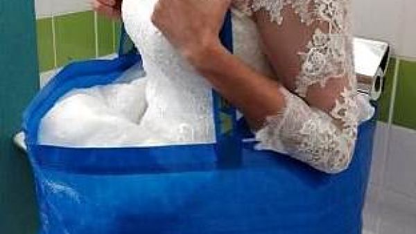 The woman used a 50p Ikea bag to protect her dress whilst sat on the toilet (Twitter)