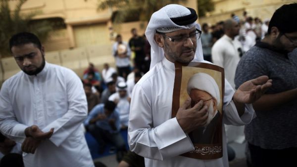 Bahraini Shia demonstrators protest the arrest and persecution of top Shia cleric Sheikh Isa Qassim.  (AFP/Mohammed Al-Shaikh)