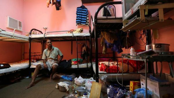 Despite substantial international pressure to reform the treatment of migrant construction workers, reports continue to find workers facing conditions that may amount to those of slavery. (AFP/File)