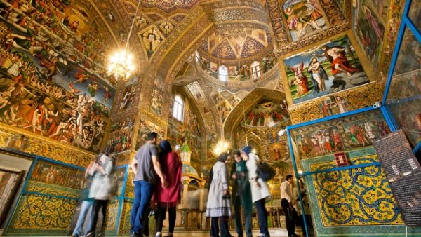 Tourists stand inside the Armenian Cathedral in Isfahan on October 15, 2014. The Cathedral, also known as the Church of the Saintly Sisters, was built in 1664. (Shutterstock)  