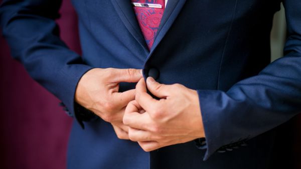 Solid colors suit everyone; avoid clothes that have too much going on. (Shutterstock)