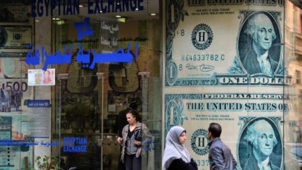 Egypt's Central Bank has sought to crack down on the black market, revoking the licenses of exchange bureaus found dealing far beyond the official rate. (AFP/Khaled Desouki)