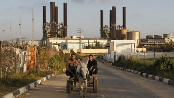Gaza Strip residents have no electricity for 16 hours a day due to limited fuel and capacity. (AFP/Mohamed Abed)