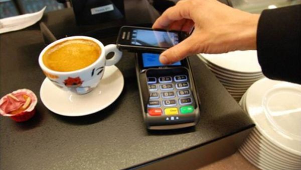 Going cashless can range from consumers paying through mobile payment applications on their smartphones, to paying through the latest wearable devices such as smart watches. (File photo)
