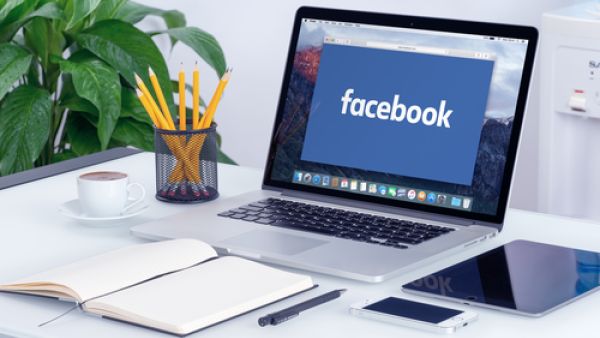 Facebook at work could be solution employers are looking for, especially since most employees are already familiar with the network. (Shutterstock/Alexey Boldin)