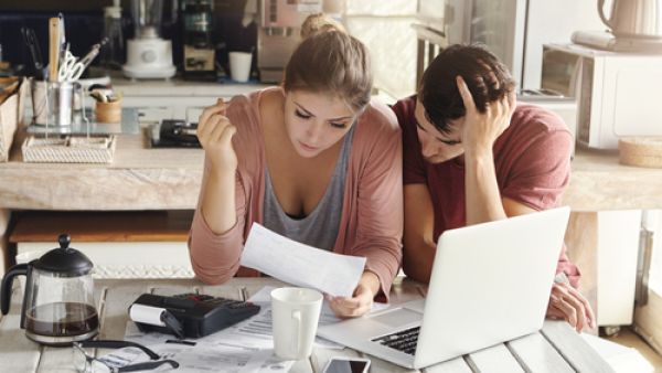 Clarifying who is responsible for paying bills and out of which bank account can help you keep track of your household spending. (Shutterstock)