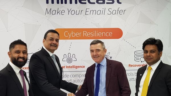Spire Solution's Sanjeev Walia shakes hands with Mimecast's Jeff Ogden Spire Solution's Sanjeev Walia shakes hands with Mimecast's Jeff Ogden