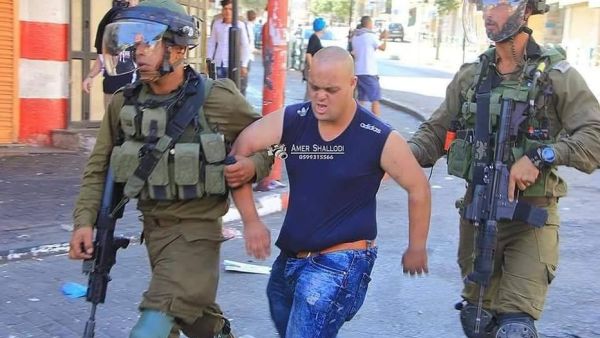 Israeli occupation soldiers arrested and assaulted a Palestinian youth with down syndrome (Twitter)