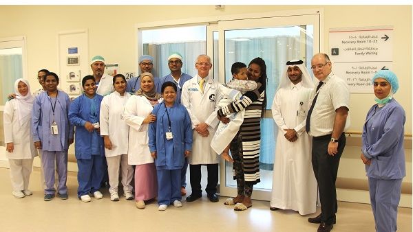 Khalid Al Jalham, Director of the Ambulatory Care Center with two-year-old Amanuel Endale and the Anesthesia and ENT team. 