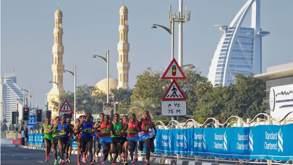 The Standard Chartered Dubai Marathon unfolds over 42km of the city's streets, involves more than 30,000 competitors and has several stretches of Dubai's road network closed for half a day.