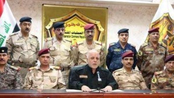 رئيس الوزراء العراقي حيدر العبادي (في المنتصف) يعلن عبر التلفزيون العراقي انطلاق الحملة على الموصل يوم 16 

